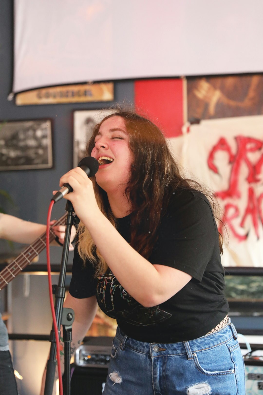 woman singing on stage